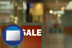 colorado map icon and a department store display advertisement