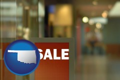 oklahoma map icon and a department store display advertisement