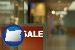 oregon map icon and a department store display advertisement