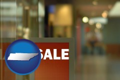 tennessee map icon and a department store display advertisement